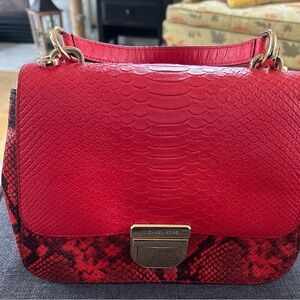 Michael Kors medium size red leopard leather purse.